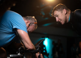 Coach working with a rider on the bike