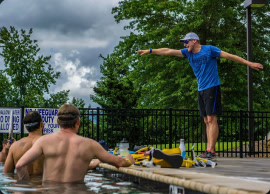 Coach leading a poolside swim session
