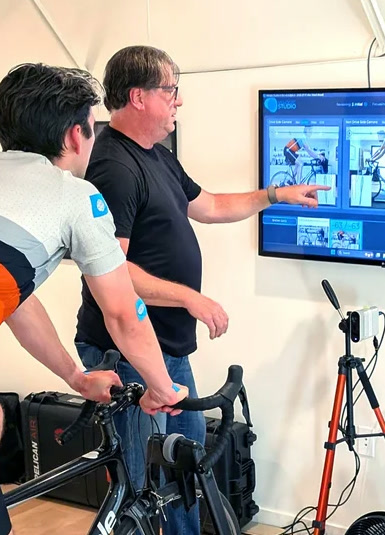 Chris Soden pointing out fit data on a screen