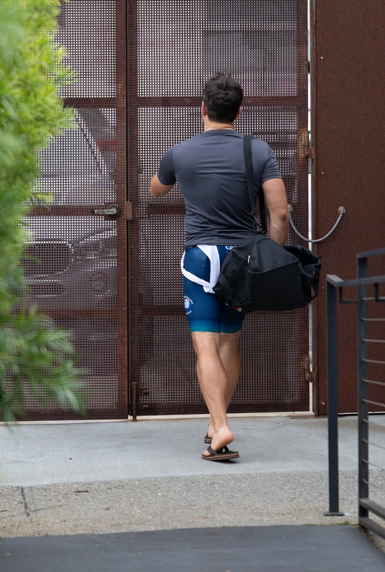 A member with a kit bag heading out through the Center’s gate