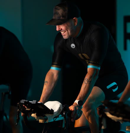 Rider smiling in the bike studio